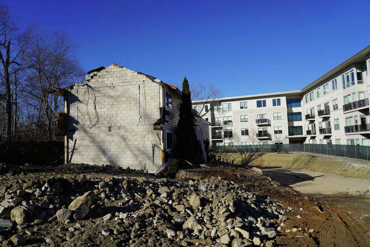 The old Canaan Parish buildings are being demolished to make room for the second affordable housing building on the corner of Route 123 and Lakeview Avenue in New Canaan on Dec. 13.