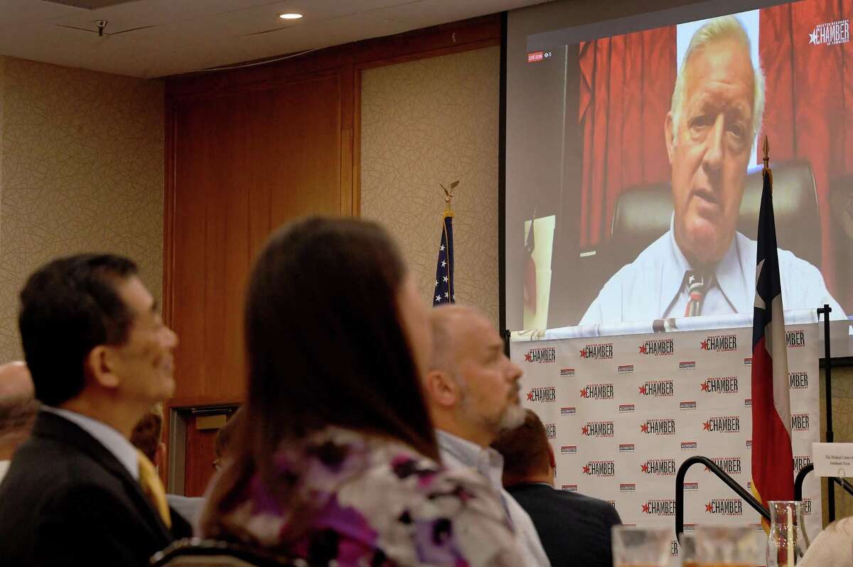 Audience members listen as Congressman Randy Weber remotely addresses the crowd gathered for a Beaumont Chamber of Commerce luncheon Tuesday. Weber was scheduled to speak at the event before being called back to Washington, D.C. for a vote. Photo made Tuesday, December 14, 2021 Kim Brent/The Enterprise