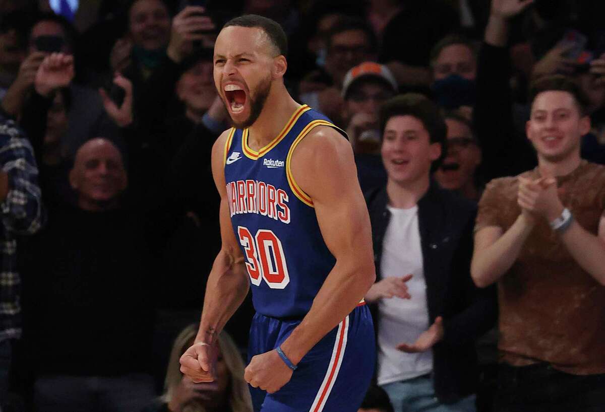 NEW YORK, NEW YORK - DECEMBER 14: Stephen Curry #30 of the Golden State Warriors celebrates after making a three point basket to break Ray Allen’s record for the most all-time against the New York Knicks during their game at Madison Square Garden on December 14, 2021 in New York City. NOTE TO USER: User expressly acknowledges and agrees that, by downloading and or using this photograph, User is consenting to the terms and conditions of the Getty Images License Agreement. (Photo by Al Bello/Getty Images)