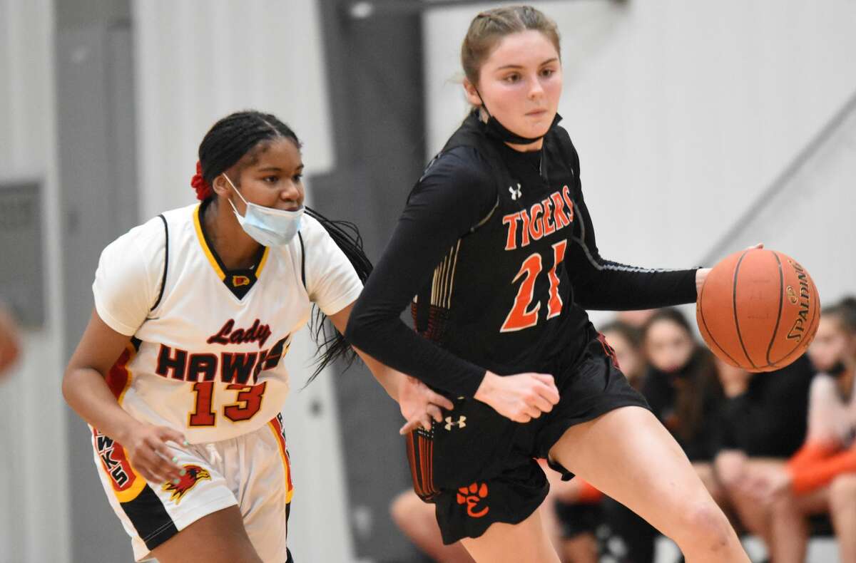 Edwardsville's Elle Evans dribbles past a defender during the first half against Lift for Life Academy on Tuesday in St. Louis.