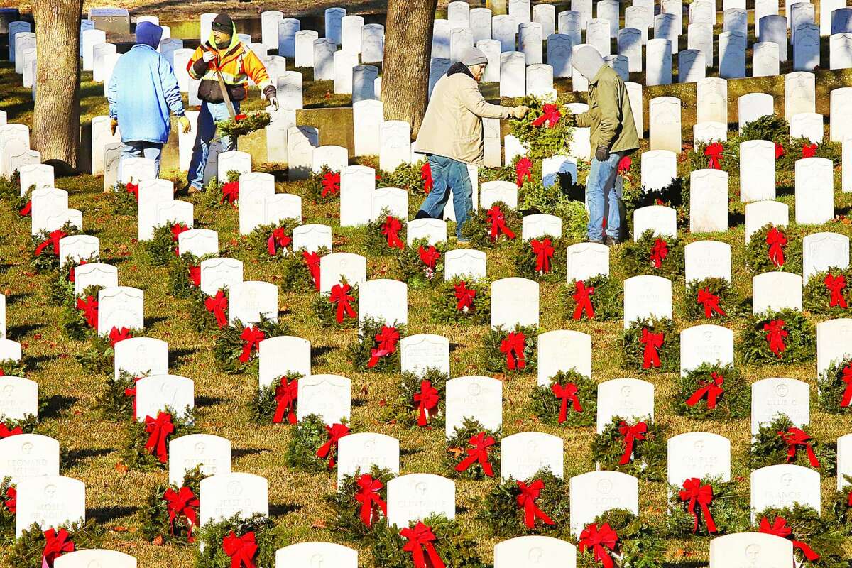 Alton City Workers worked last year clearing all of the 560 wreaths from the graves at the U.S. National Cemetery on Pearl Street in Alton. The 15th annual ceremony will take place at 11 a.m. Saturday, Dec. 18.