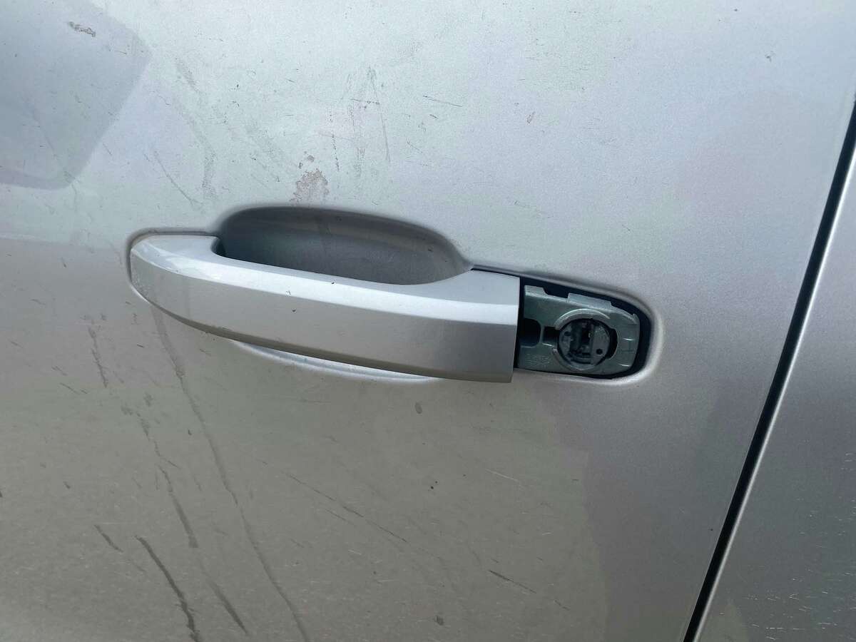 Tampering can be seen on this door handle. State police determined that this gray Chevrolet Silverado was reported stolen out of San Antonio. A man was arrested in relation to the case.