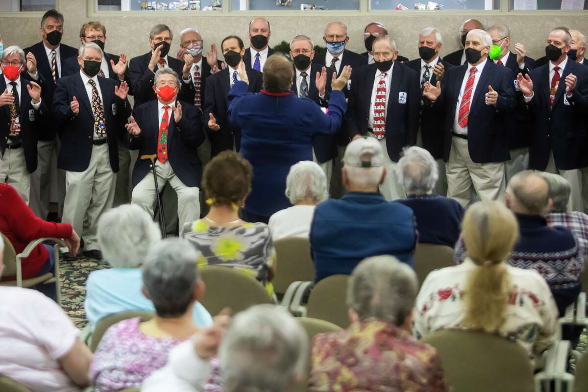 The Men of Music singing group performs a concert for residents of Washington Woods senior living community Tuesday, Dec. 14, 2021 in Midland.