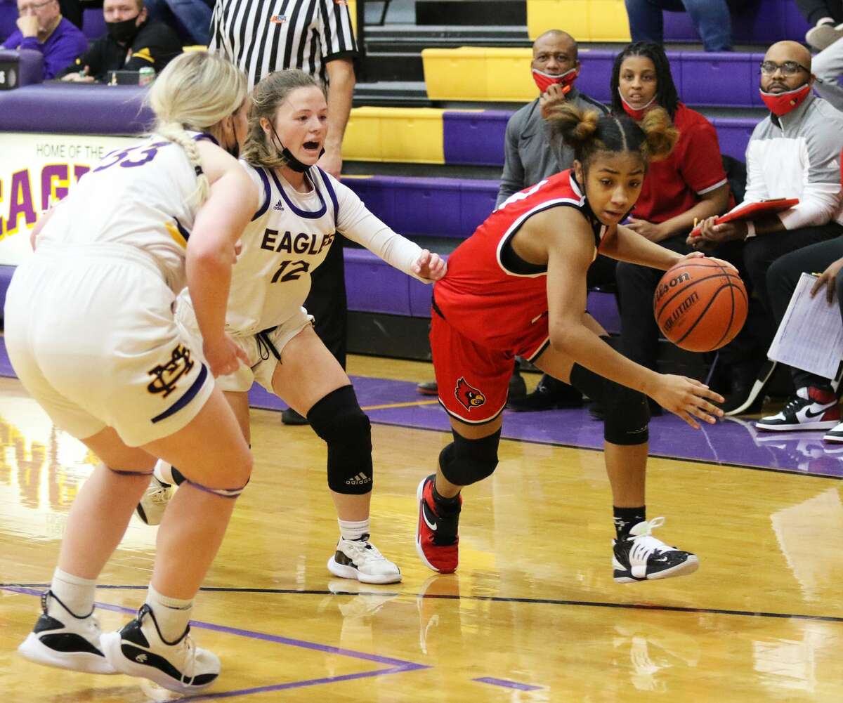 Alton's Kiyoko Proctor (right) scored 14 points in her team's win over Breese Mater Dei in Tuesday night's semifinals of the Mascoutah Christmas Tournament. She is shown playing against Civic Memorial earlier this season.  