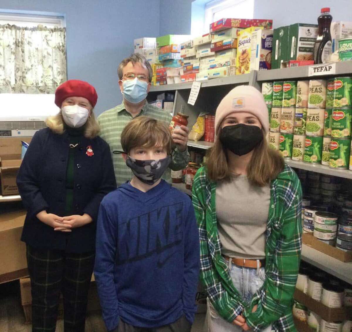 Torrington church members stock pantry shelves for FISH