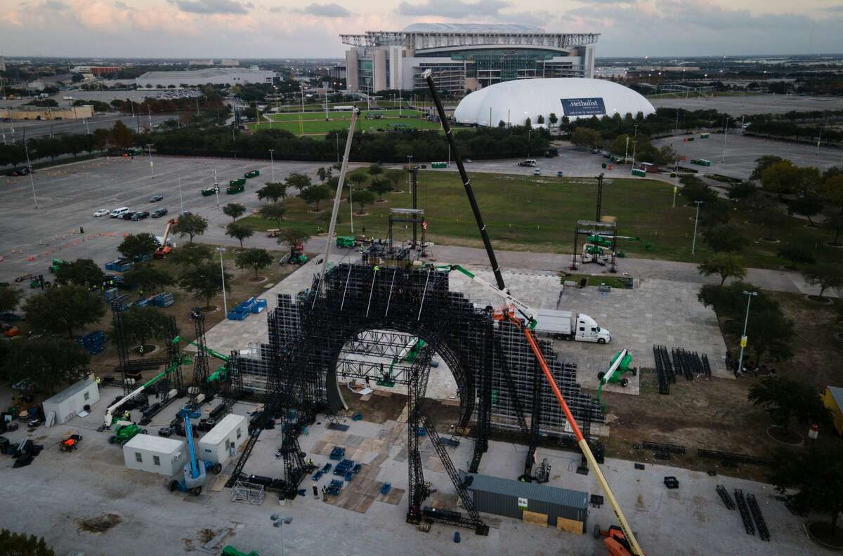 Workers disassemble the site of the Astroworld music festival Wednesday, Dec. 15, 2021, at NRG Park in Houston.