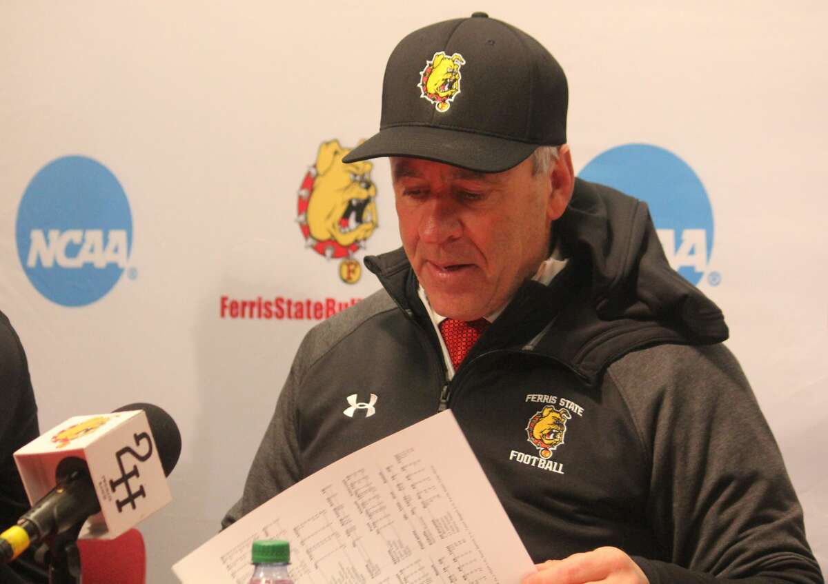 Ferris State football coach Tony Annese looks through the stat sheet after Saturday's 55-7 semifinal win over Shepherd.