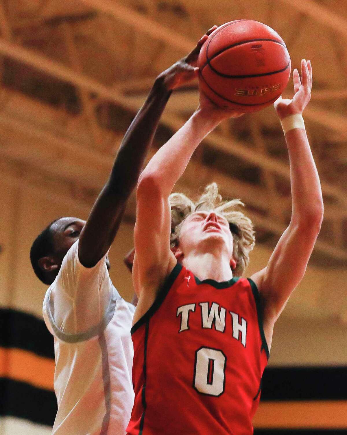The Woodlands guard Ty Sheldon (0) is fouled during the fourth quarter of a high school basketball game at Klein Oak High School, Wednesday, Dec. 15, 2021, in Spring.