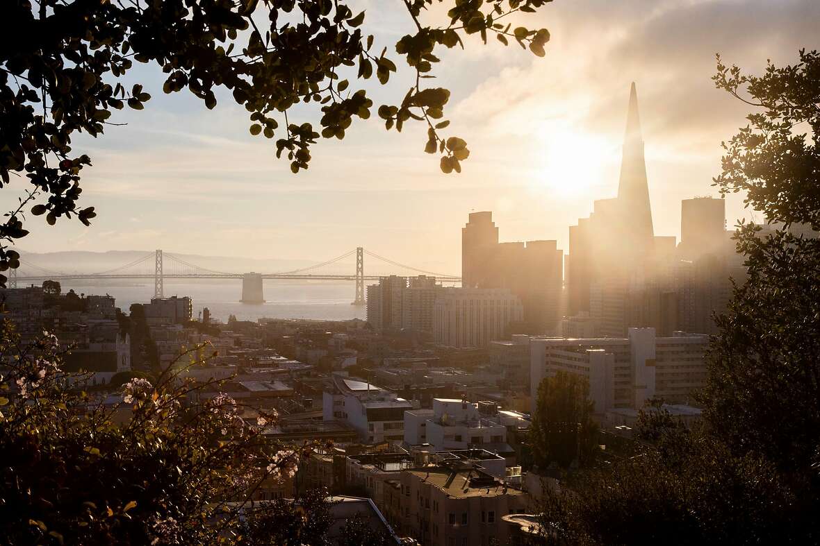 The San Francisco skyline is seen at sunrise from Ina Coolbrith Park in the Russian Hill neighborhood of San Francisco, Calif. Tuesday, October 19, 2021.