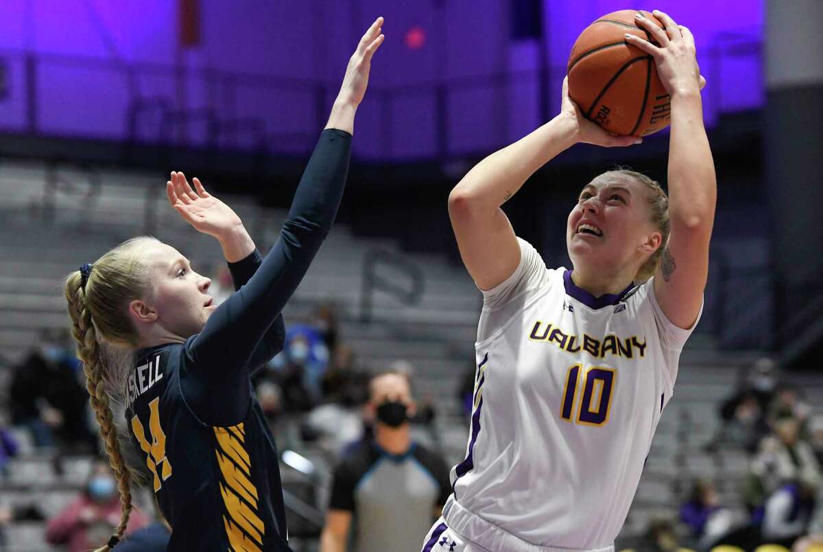 Canisius guard Dani Haskell (14) defends against Albany guard Ellen Hahne (10) during an NCAA basketball game Wednesday, Dec. 15, 2021, in Albany, NY