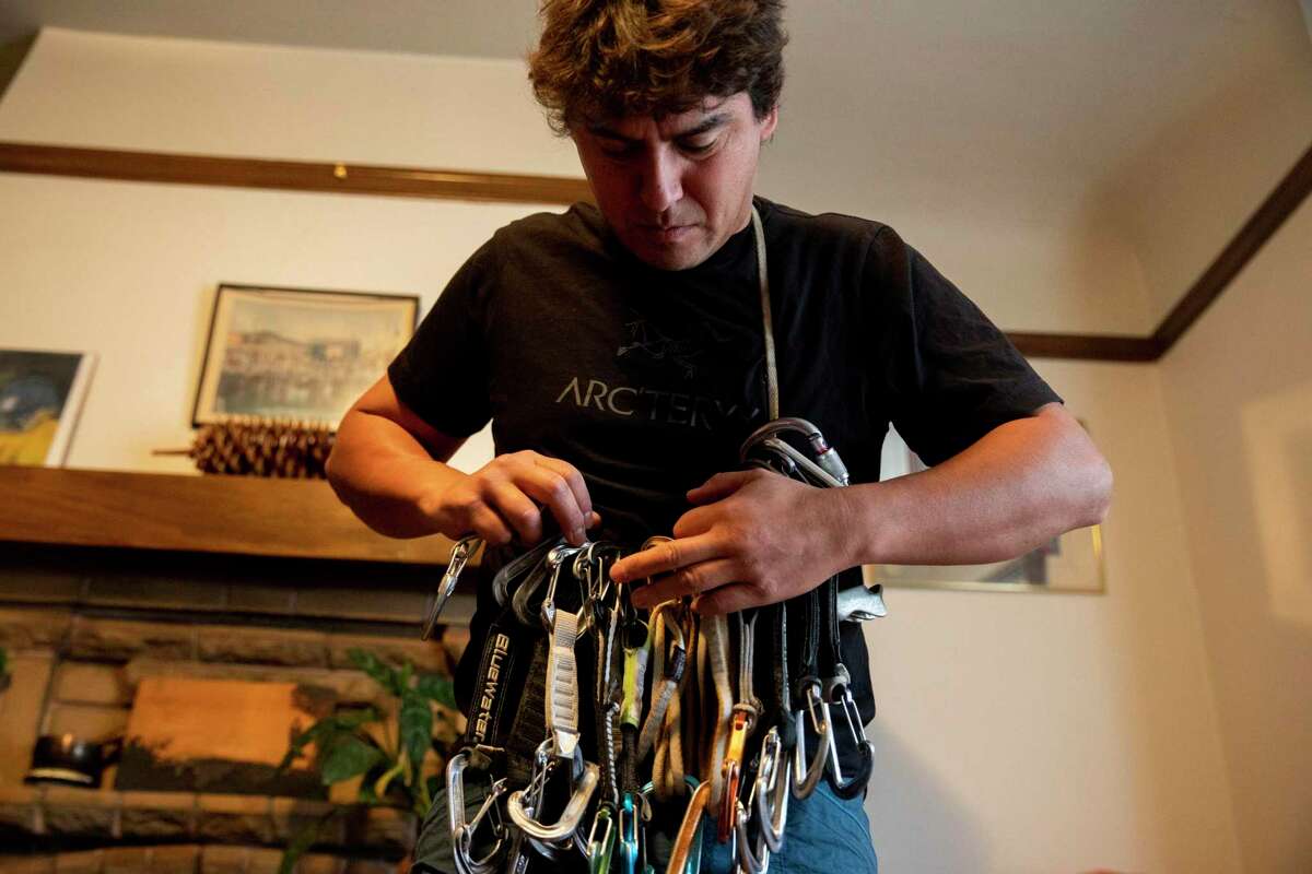 Lucho Rivera gathers his gear while preparing for a climbing trip at his home in the Mission District of San Francisco.