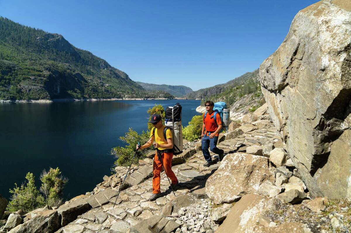 Climbers Lucho Rivera and Timmy O'Neill explore the granite walls of the Hetch Hetchy Valley in Yosemite National Park for a film project. They hope to publicize a proposal to drain the tank and