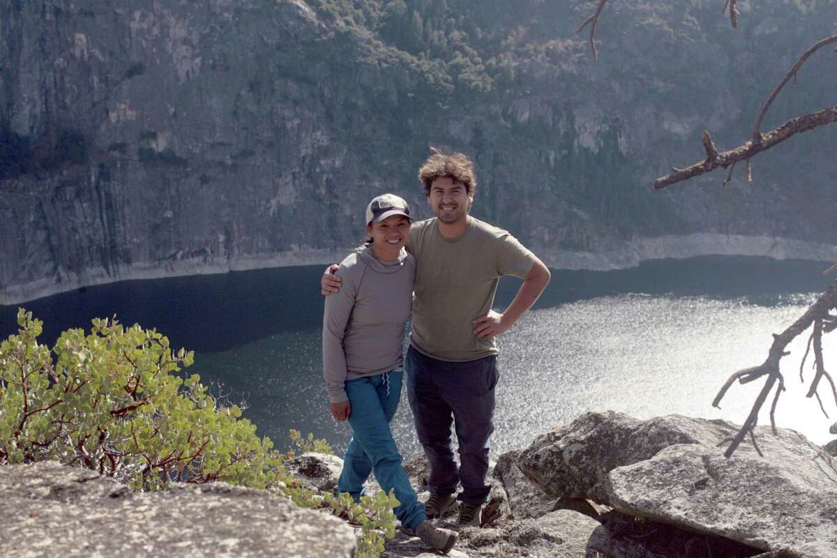 Climbers Lucho Rivera and Mecia Serafino climb to the top of a granite wall above Wapama Falls on the north side of Hetch Hetchy Reservoir in Yosemite National Park.
