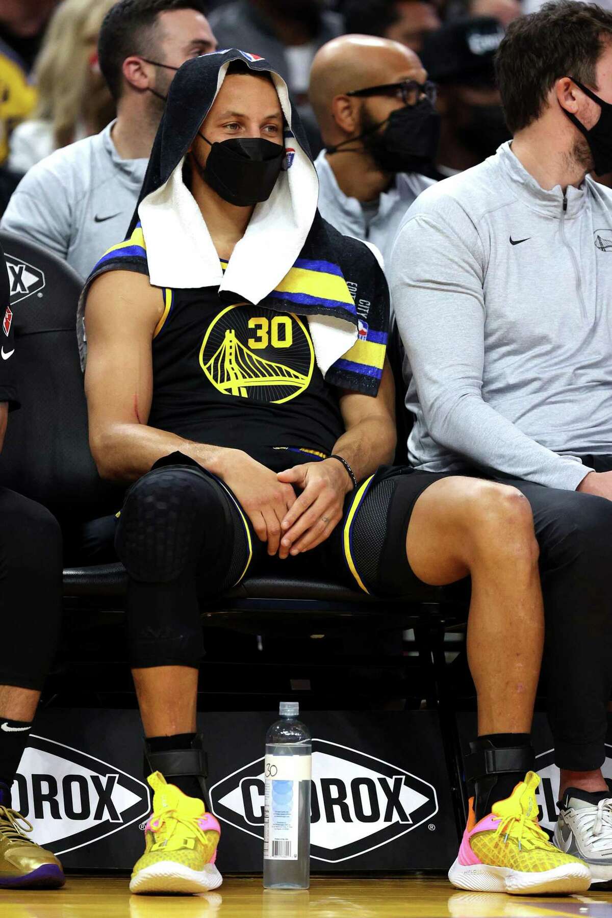 SAN FRANCISCO, CALIFORNIA - NOVEMBER 26: Stephen Curry #30 of the Golden State Warriors looks on from the bench during the first half of the game against the Portland Trail Blazers at Chase Center on November 26, 2021 in San Francisco, California. NOTE TO USER: User expressly acknowledges and agrees that, by downloading and or using this photograph, User is consenting to the terms and conditions of the Getty Images License Agreement. (Photo by Ezra Shaw/Getty Images)