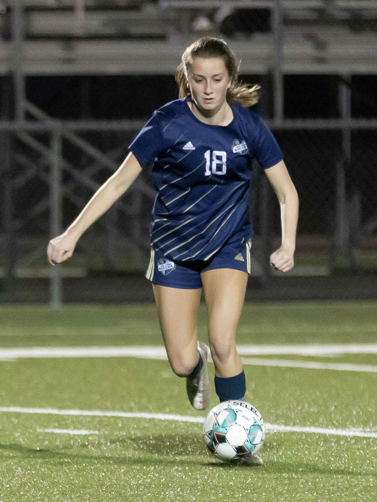 Lake Creek Taylor Hampton (18) drives the ball during the first half of a District 20-5A girls soccer game against Caney Creek at Lake Creek High School, Friday, March 12, 2021, in Montgomery.