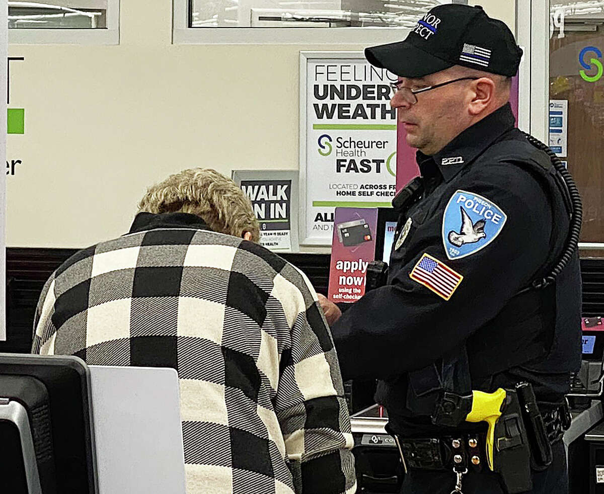 Dozens of law enforcement officers, firefighters, EMS workers, veterans, service members and others accompanied kids at the Bad Axe Meijer store on Wednesday as they picked out Christmas gifts for their families as part of the annual Shop with a Hero program.