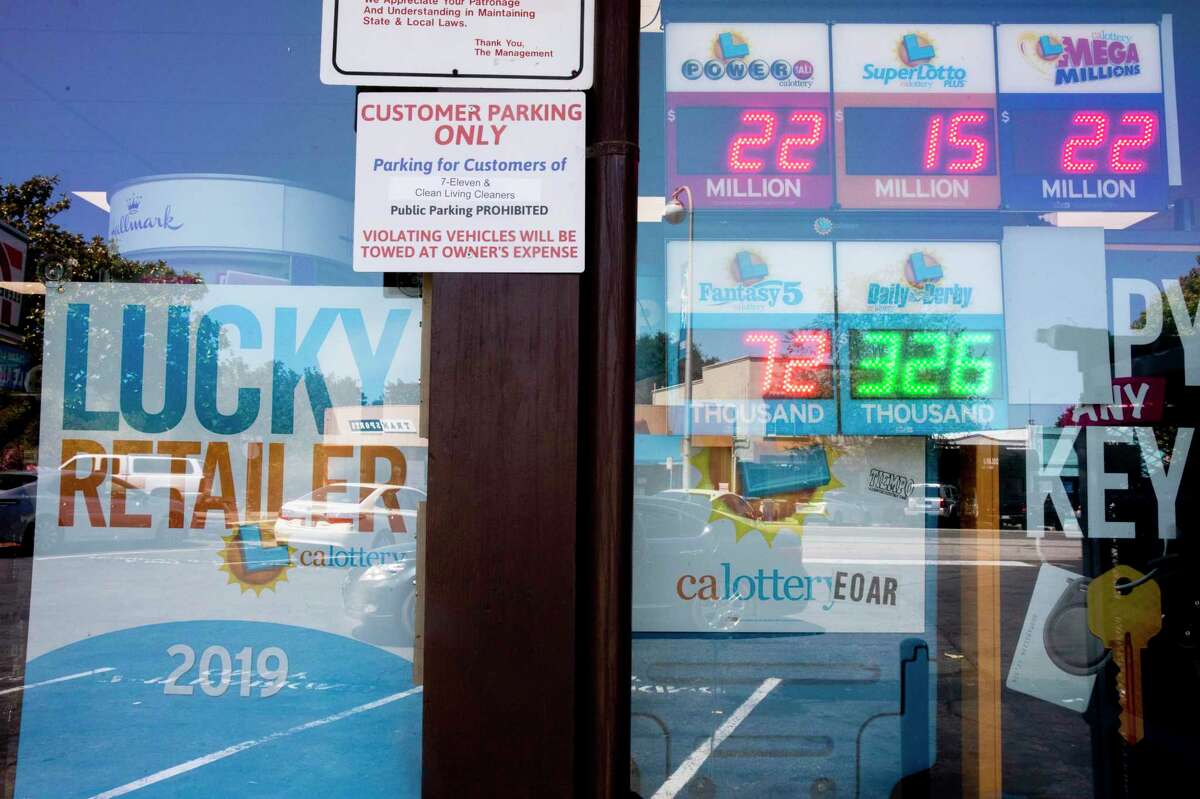 Advertisements for the California Lottery are seen outside of 7-Eleven in Albany, Calif. A winning $11 million ticket was sold at a 7-Eleven store in San Jose.