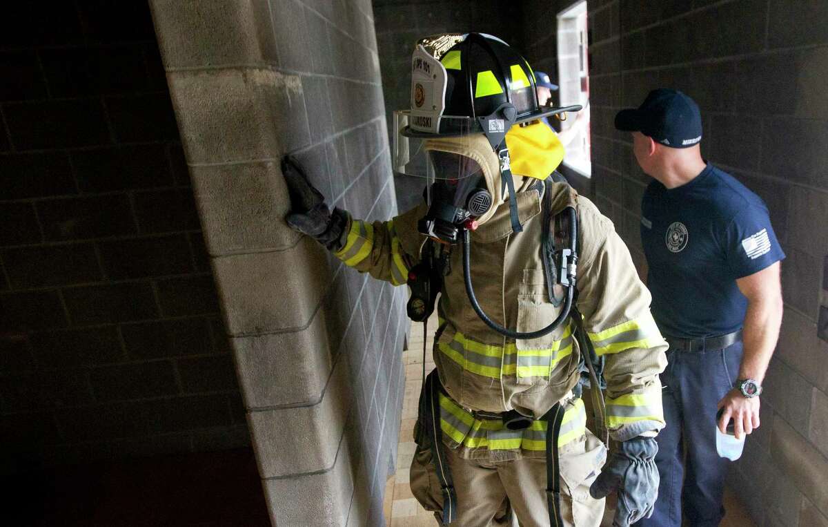 Conroe Mayor Jody Czajkoski explores a room as part of Conroe Fire Department’s Fire Ops 101 training. The Conroe Fire Department has been approved to receive a fire response vehicle through a grant program with the Texas Forest Service.