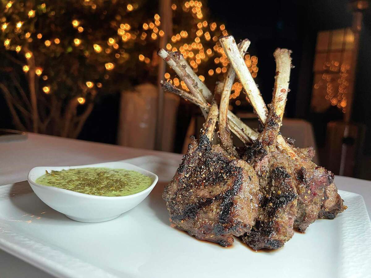 Lamb chops on a stick are served with a feta and mint dip sauce on the Up Scale.