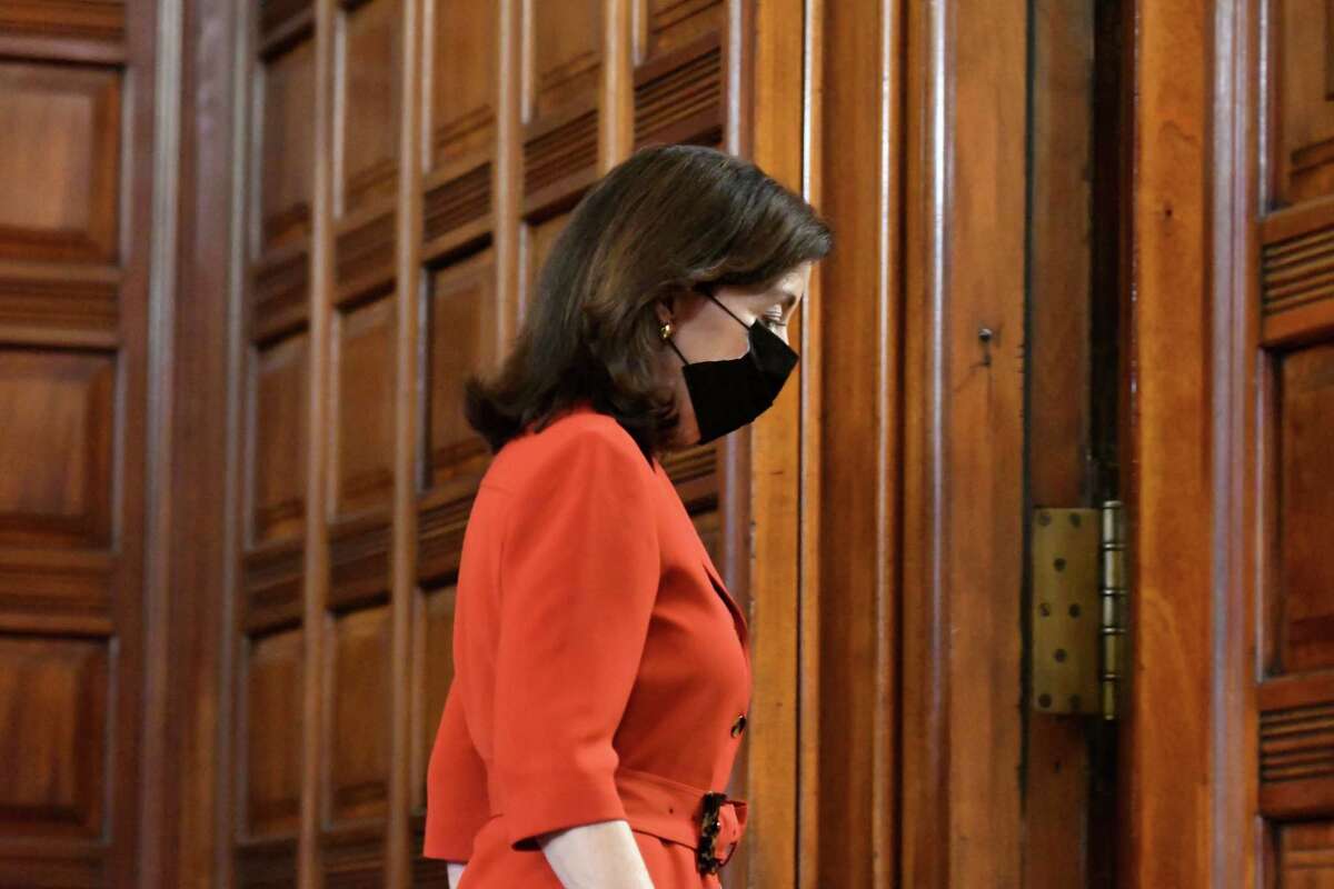 Gov. Kathy Hochul leaves the Red Room after holding coronavirus news briefing where she discussed the potential dangers faced by spread of the new omicron COVID-19 variant on Thursday, Dec. 16, 2021, in the Red Room at the Capitol in Albany, N.Y.