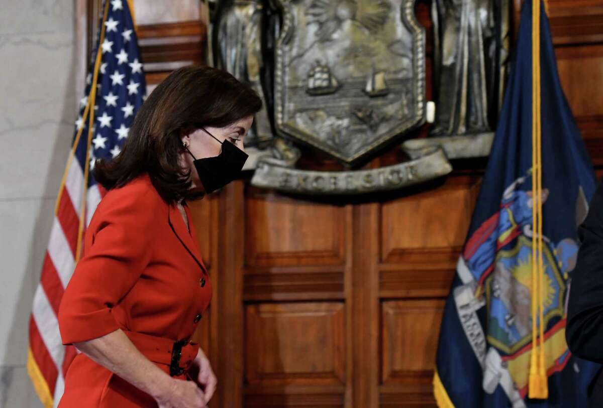 Gov. Kathy Hochul leaves the Red Room after holding coronavirus news briefing where she discussed the potential dangers faced by spread of the new omicron COVID-19 variant on Thursday, Dec. 16, 2021, in the Red Room at the Capitol in Albany, N.Y.