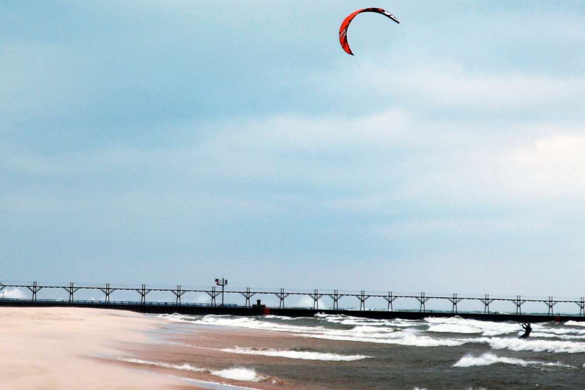 Windsurfers took over Fifth Avenue Beach on Thursday. Despite the wind chill creating a feels-like temperature of 27 degrees, two adventurous windsurfers rode the waves and wind. The National Weather Service projected wind speeds of 25-35 miles per hour and gusts up to 60 miles per hour.