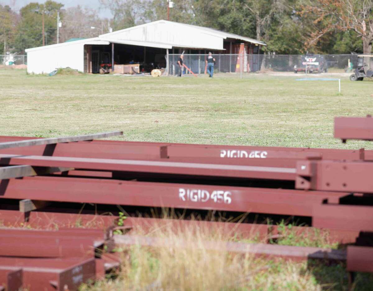 Steel sections are seen outside a grassy area where God’s Garage will build a new operation facility that will expand their capacity, Thursday, Dec. 16, 2021, in Conroe. The non-profit ministry organization provides vehicles to signal mothers, widows and wives of deployed military members.