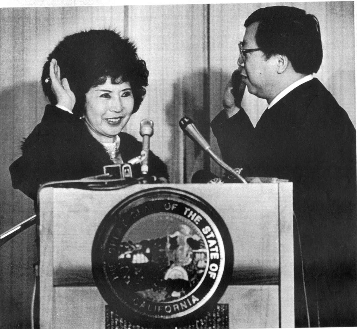 Secretary of State March Fong Eu is sworn in for her fourth term as she takes the oath of office from State Appellate Court Justice Harry Low in 1987.