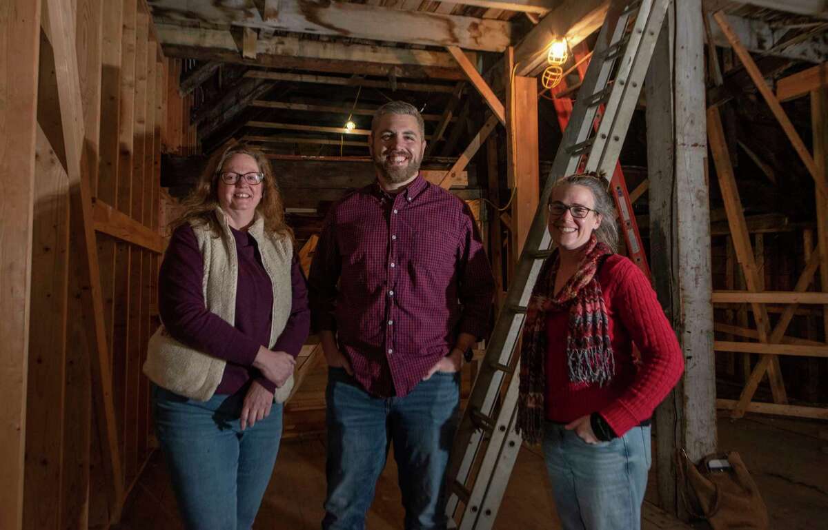 Historic Albany Foundation members, from left, Pamela Howard, executive director, Matt Malette, board president, and Cara Macri, preservation services director, stand inside 48 Hudson Ave., the city's oldest building on Thursday, Dec. 16, 2021 in Albany, N.Y. HAF announced they will move their offices from Lexington Ave. to 48 Hudson Ave.
