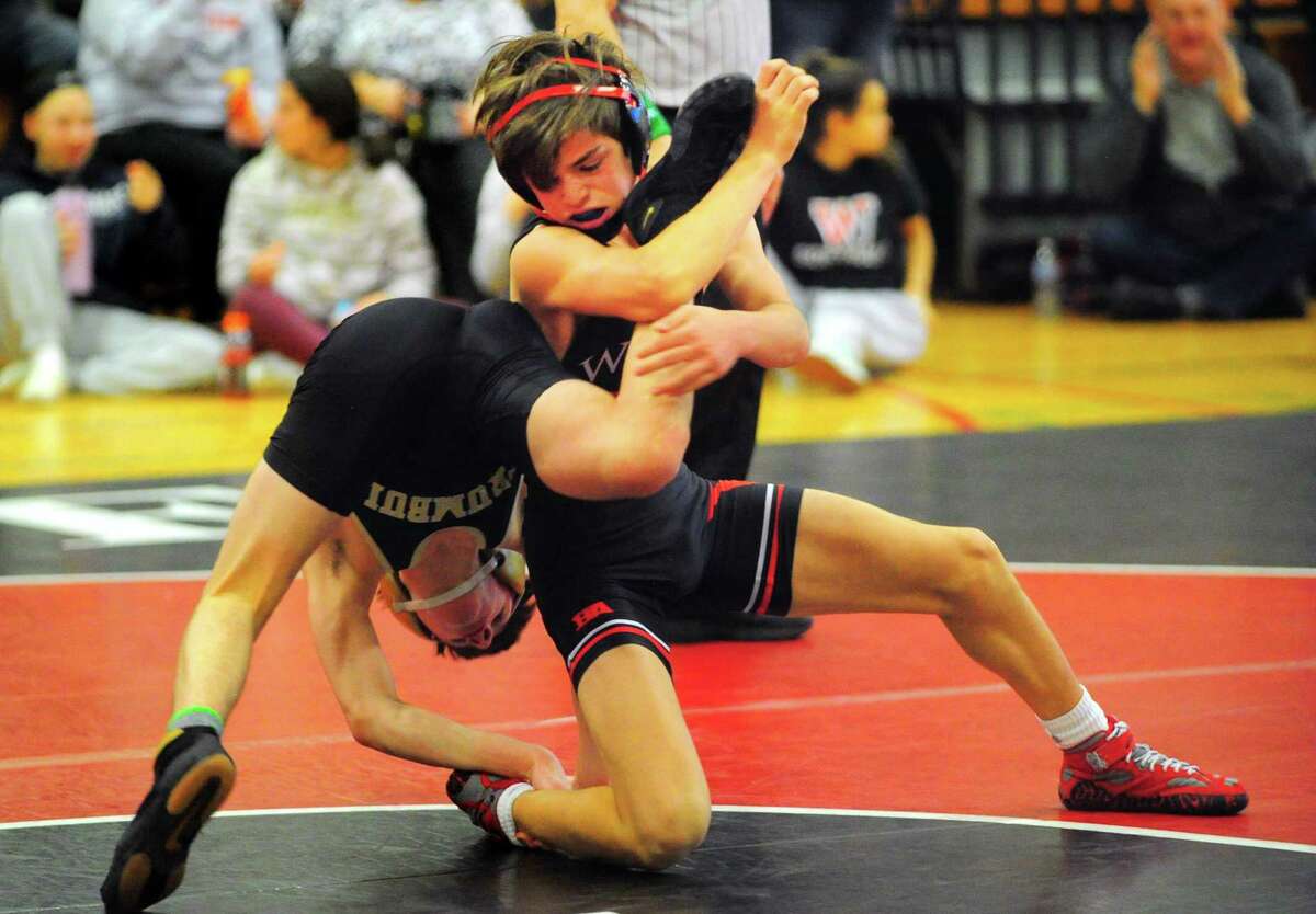 Fairfield Warde’s Lucas Coleman tries to turn over Trumbull’s Andrew Grabinski during a match in 2020.