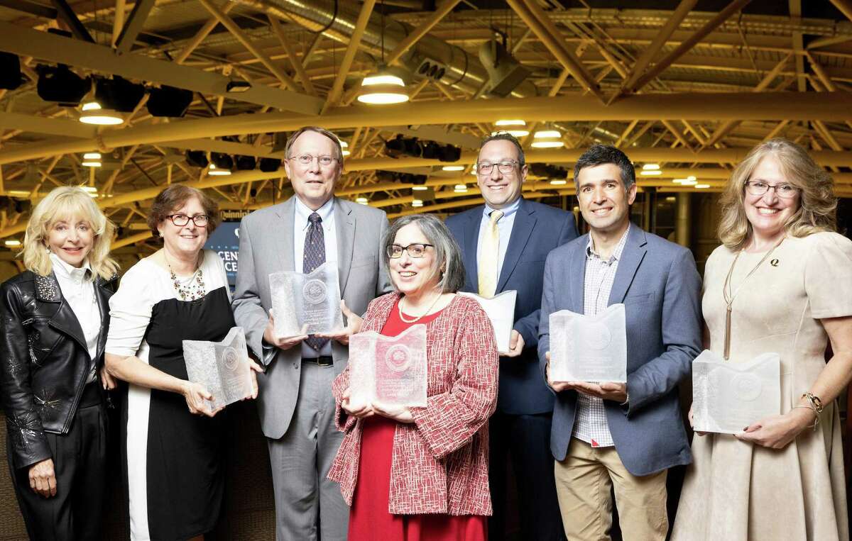 Quinnipiac University recently recognized three faculty members and three staff members as recipients of the 2021 Center for Excellence in Teaching and Service to Students Awards. From left, Quinnipiac President Judy Olian with honorees Jill Martin, Thomas Army, Laura Mutrie, Mike Medina, Jose Riofrio and Deanna Proulx-Sepelak.
