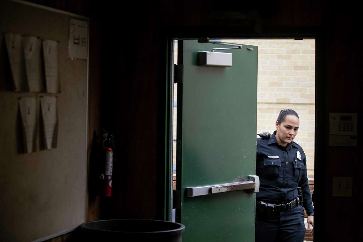 Officer Sara Munoz closes the door to a classroom at San Antonio Police Training Academy.