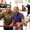 Gaspar Ortega and son Michael Ortega are regarded by some as the first family of New Haven Boxing, with Gaspar a trainer and Michael a referee. They are shown at the Hamden Community Center rink in 2005. Gaspar Ortega died on Thursday.