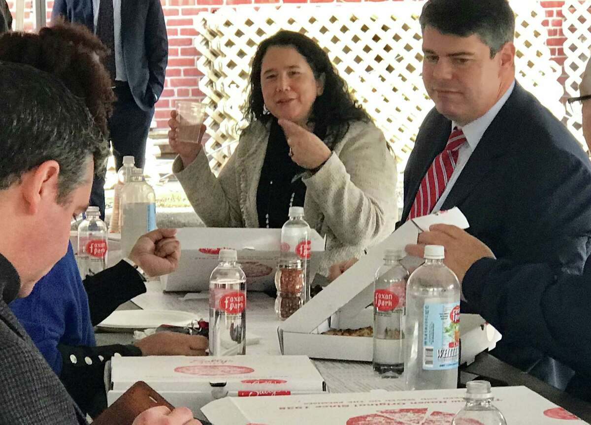 Isabella Casillas Guzman, administrator of the Small Business Administration, is shown at Sally’s Apizza with New England Regional Administrator Mike Vlacich, left.