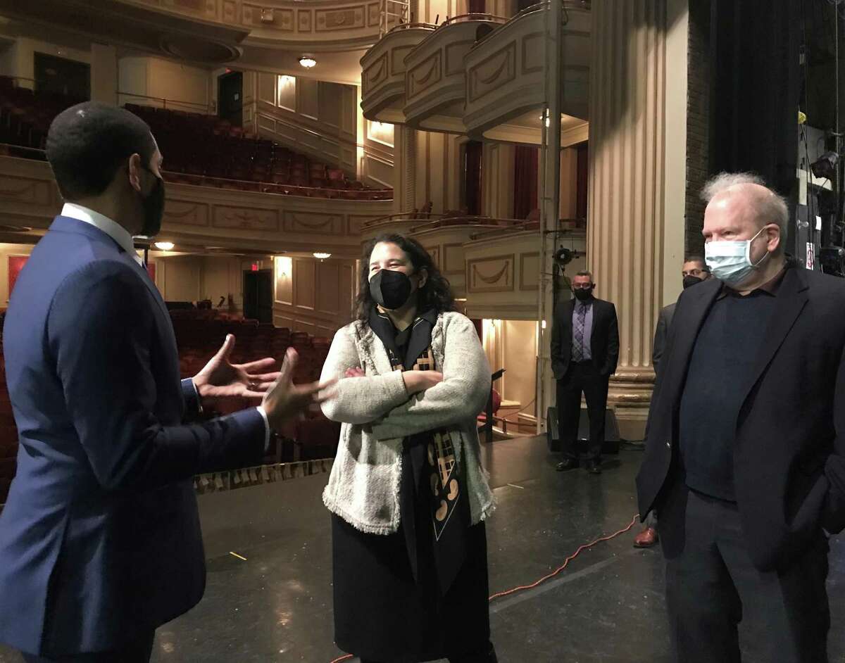 Isabella Casillas Guzman, administrator of the Small Business Administration, is shown at the Shubert Theater in New Haven, talking with Anthony McDonald, the Shubert executive director, left, and Brian Phelps, president of Toad’s Place.
