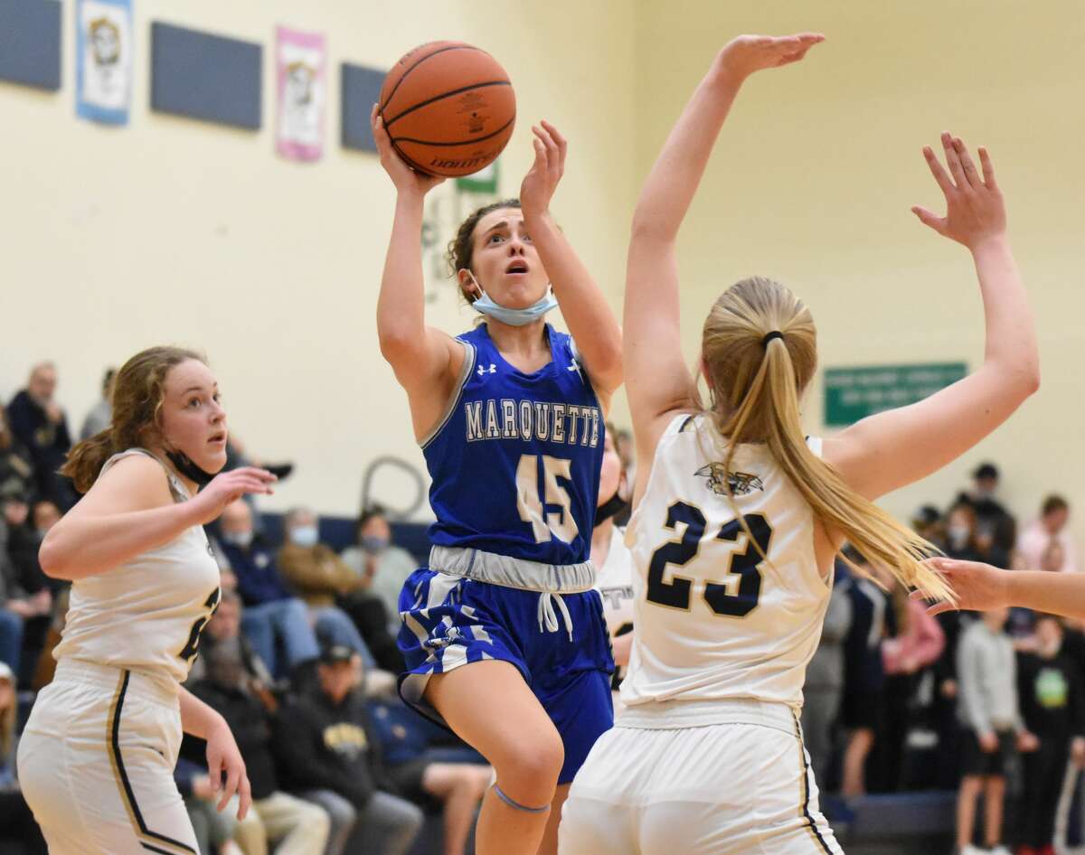 Marquette Catholic's Chloe White puts up a running jumper during the second half against Father McGivney  on Thursday in Glen Carbon.