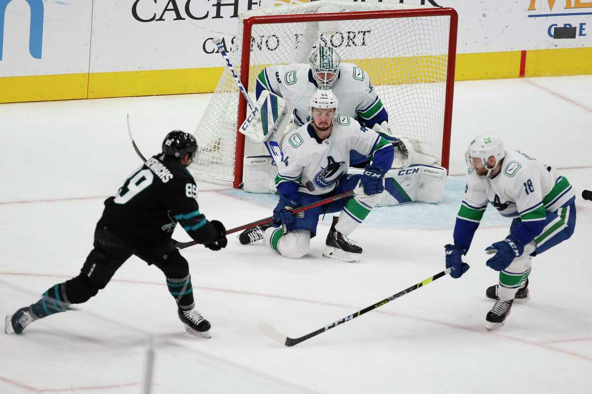 Vancouver Canucks defenseman Kyle Burroughs (44) makes a save against San Jose Sharks left wing Jayden Halbgewachs (89) during the first period of Thursday’s game.