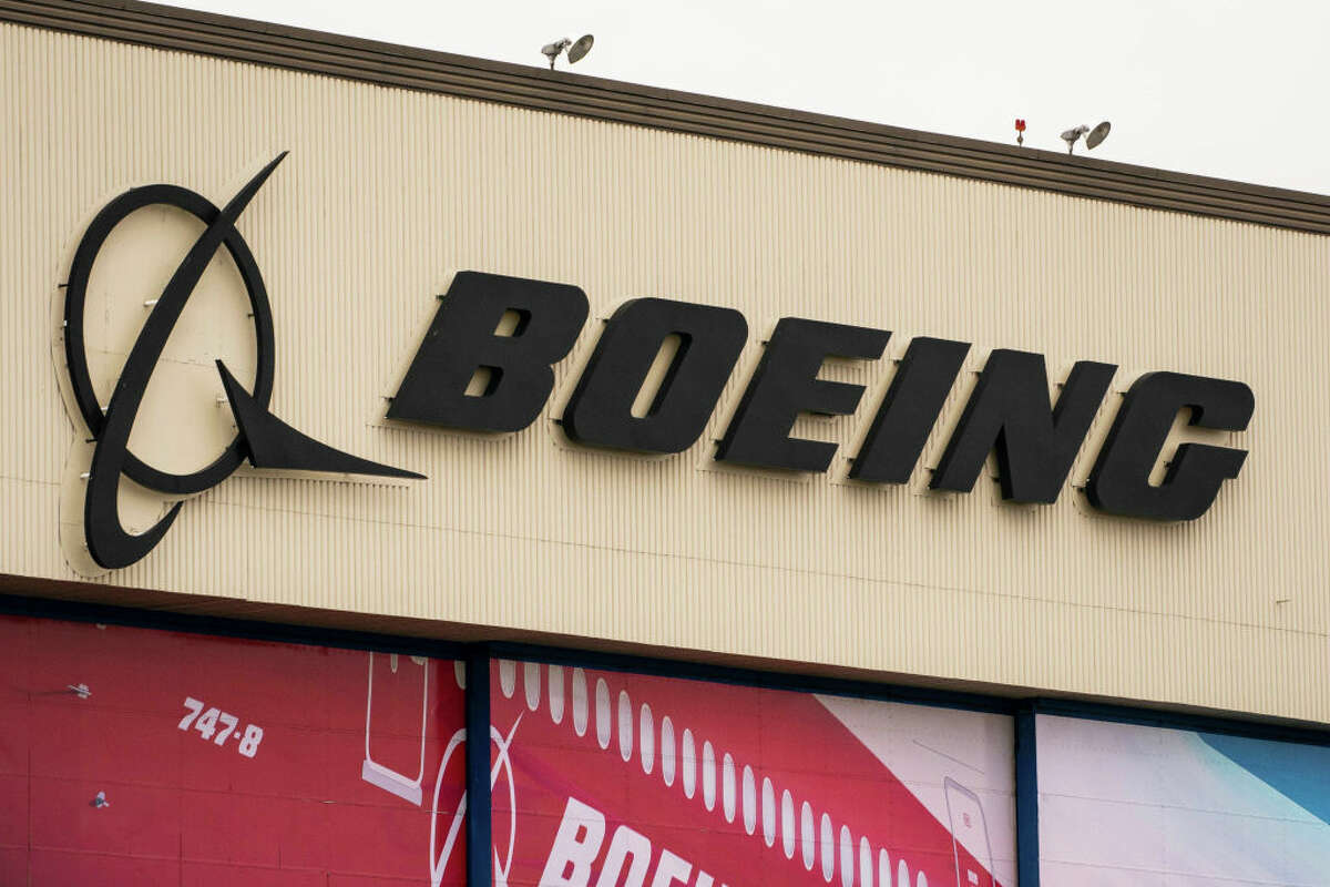 A sign on the exterior of Boeing's airplane production facility is seen on Feb. 22, 2021 in Everett, Wash. (Photo by David Ryder/Getty Images)