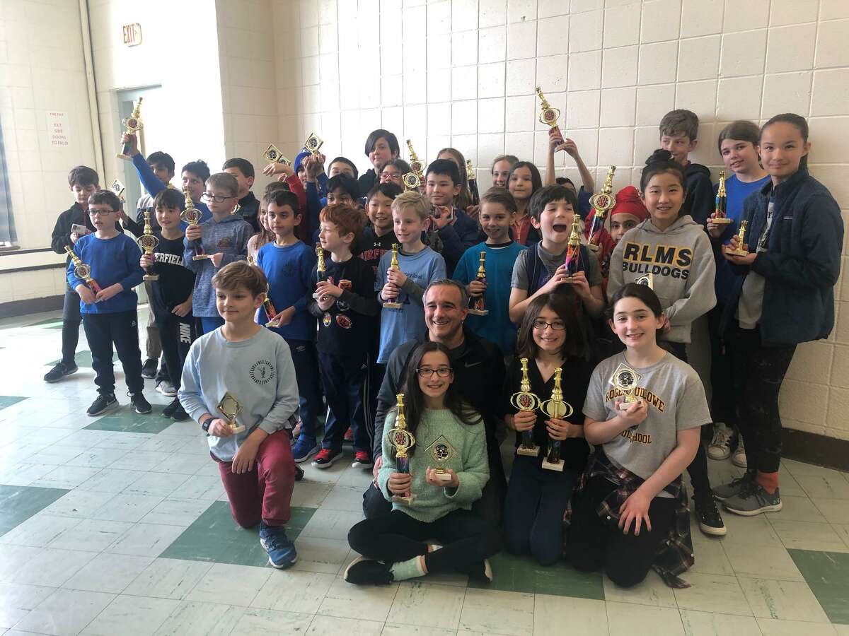Riverfield and RLMS chess teams with their NECA tournament trophies in February of 2020.