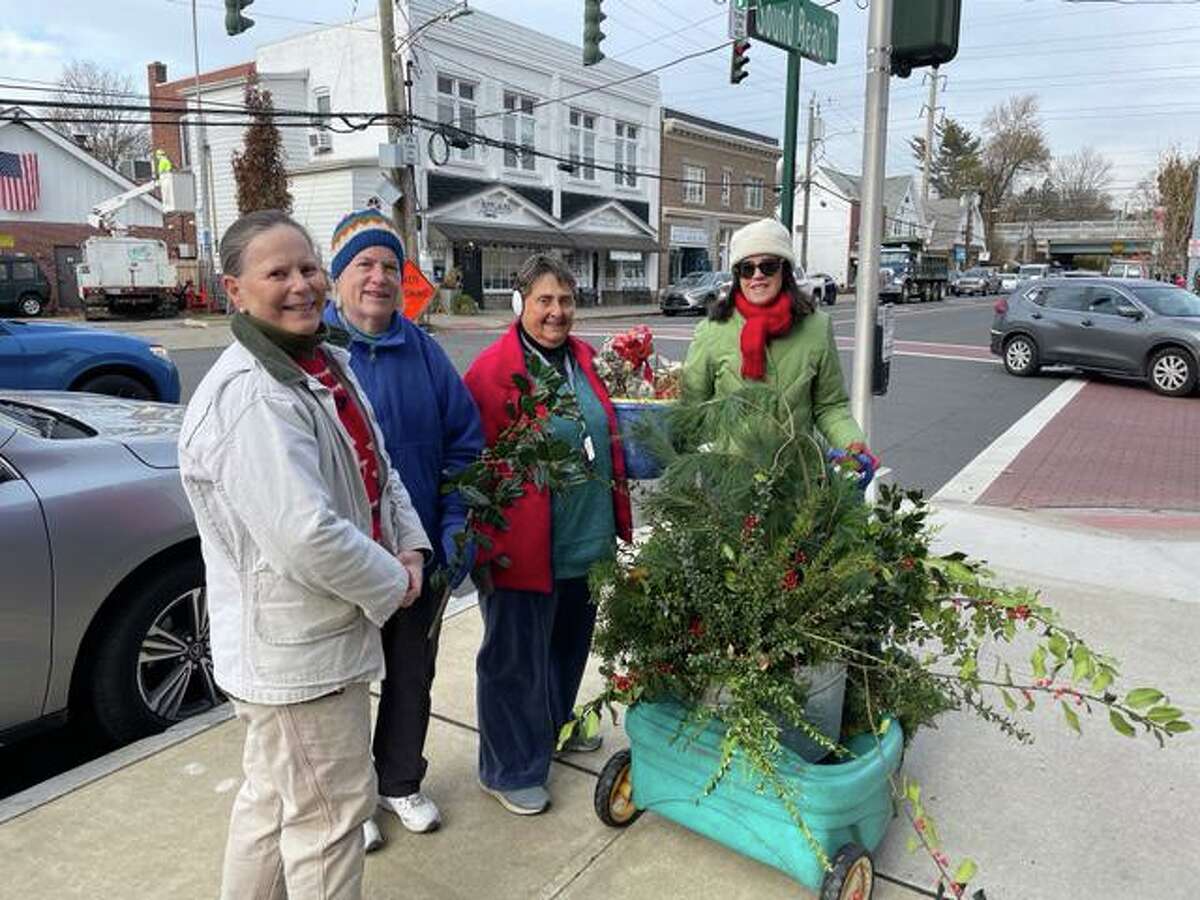 Garden Club of Old Greenwich members, from left, Betsy Kreuter, Linnea Stenberg, Margaret Gianquinto and Ellie Bowman are among the many who took part in decorating Sound Beach Avenue for the holiday season.