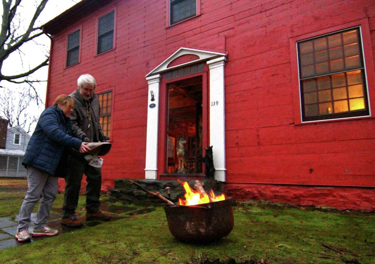 The winter solstice celebration of the longest night was held at the historic John Downs House along North Street in Milford, Conn., on Friday Dec. 21, 2018. In addition to a tour of the historic home's first floor, cauldrons were lit to provide warmth and light. Chestnuts were provided to toss into the fire, symbolizing cleansing negativity from the previous year.