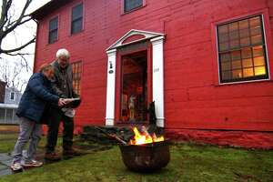 The winter solstice celebration of the longest night was held at the historic John Downs House along North Street in Milford, Conn., on Friday Dec. 21, 2018. In addition to a tour of the historic home's first floor, cauldrons were lit to provide warmth and light. Chestnuts were provided to toss into the fire, symbolizing cleansing negativity from the previous year.