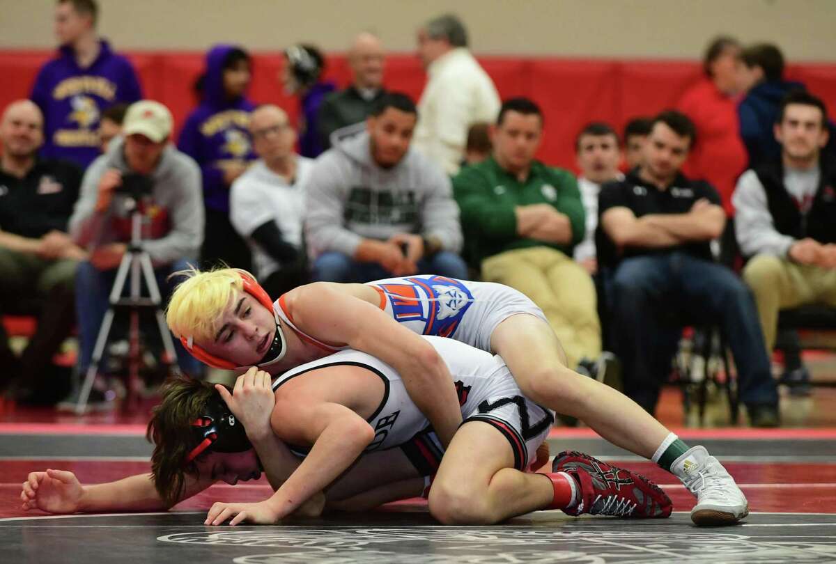Fairfield Warde wrestler Lucas Coleman competes against Kai O’Dell of Danbury in the 113-pound bout during the FCIAC championships in 2020.