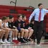 New Canaan boys basketball coach Danny Melzer directs the Rams during a game at NCHS.