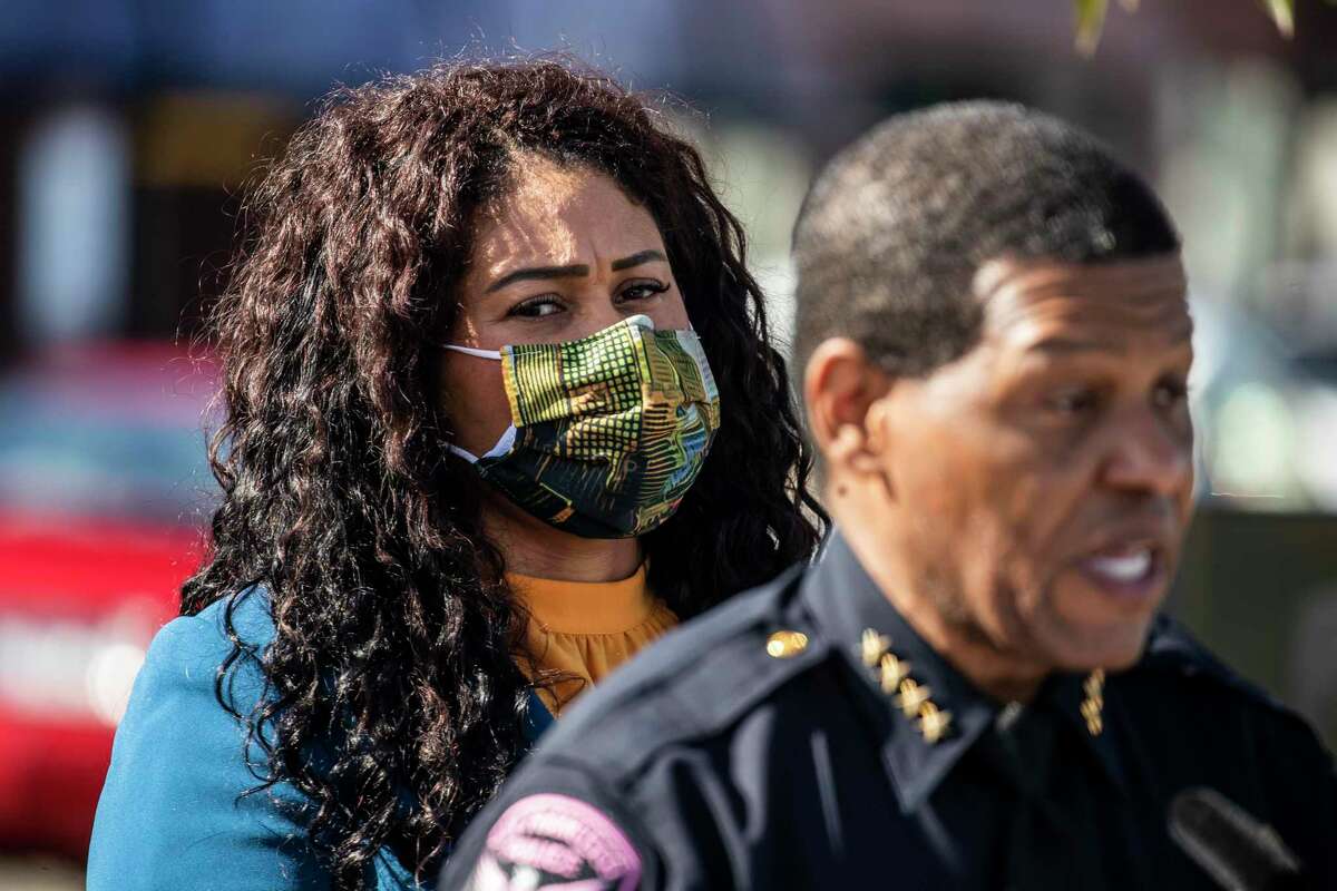 San Francisco Mayor London Breed is seen as Police Chief William Scott speaks during a press conference announcing a new auto burglary deterrence incentive in front of Ghirardelli Square in San Francisco, Calif. Tuesday, Oct. 19, 2021.