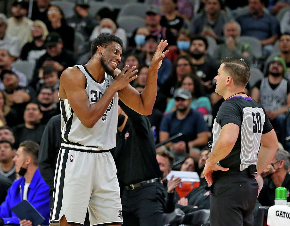 SAN ANTONIO, TX - NOVEMBER 24: Thaddeus Young #30 of the San Antonio Spurs argues a foul called on him against the Atlanta Hawks with official Gediminas Petraitis in the first half at AT&T Center on November 24, 2021 in San Antonio, Texas. NOTE TO USER: User expressly acknowledges and agrees that , by downloading and or using this photograph, User is consenting to the terms and conditions of the Getty Images License Agreement. (Photo by Ronald Cortes/Getty Images)