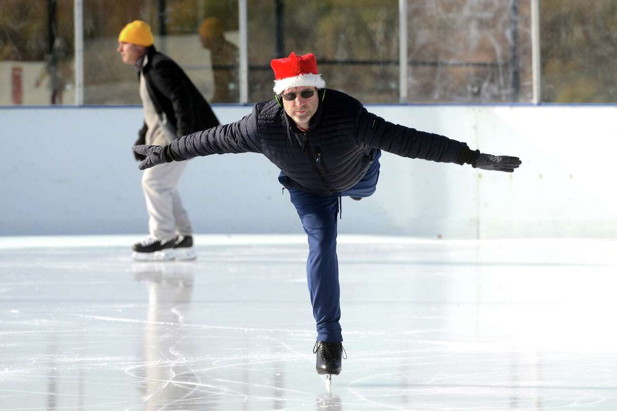 Stefan Baer, of Westport, enjoys an afternoon of ice skating at the outdoor PAL Rink at Longshore, in Westport, Conn. Dec. 17, 2021.