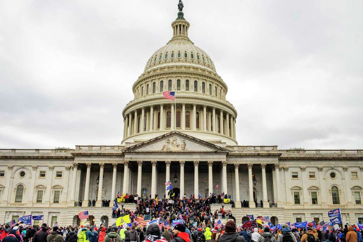 People storm the Capitol on Jan. 6.