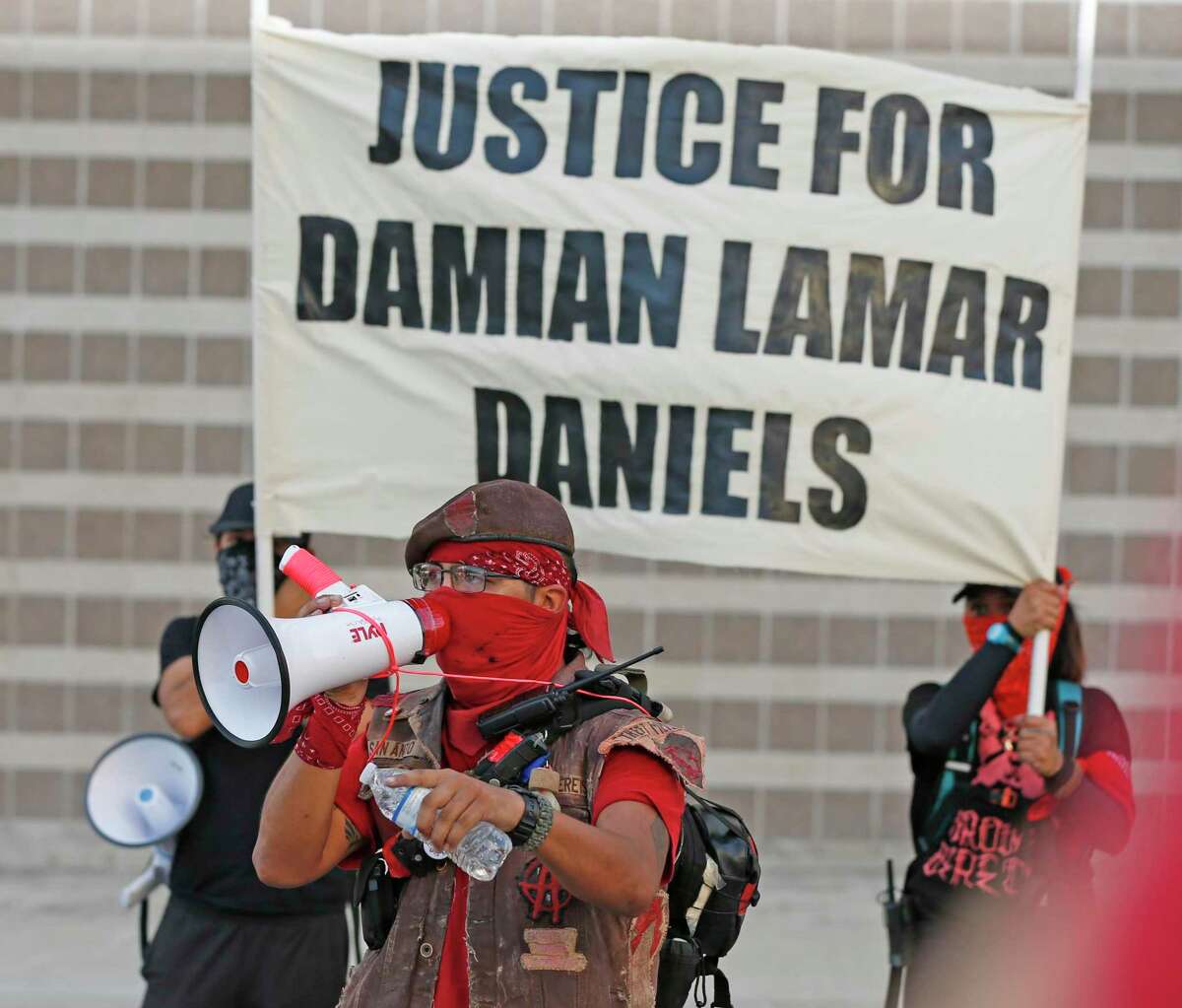 Community members rally in support of Damian Lamar Daniels after he was killed by Bexar County Sheriff’s deputies in 2020. Daniels’ family is calling for the city and county to reform its mental health response.