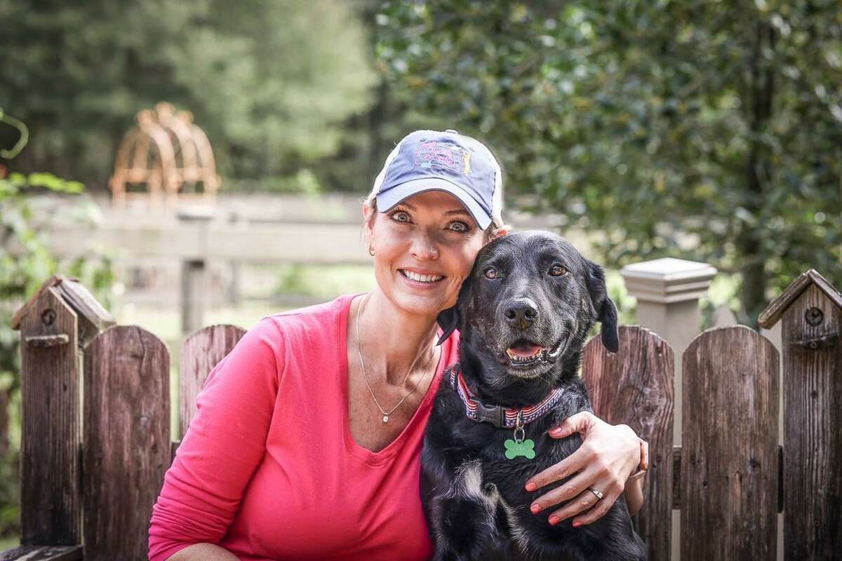 A Lone Star Animal Welfare League foster mom with her lab, Buddy.